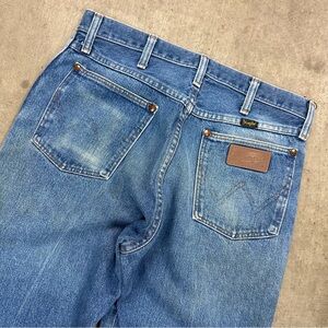 Vintage Wrangler distressed and faded blue jeans
